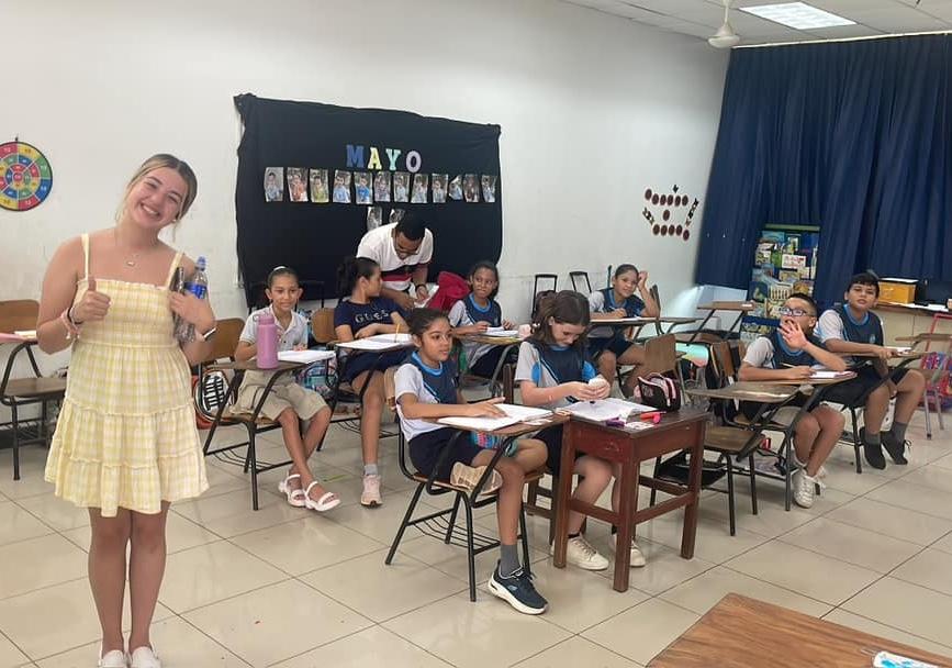 Halee Pfingsten stands in one of the classrooms she and her peers taught during their study abroad trip.